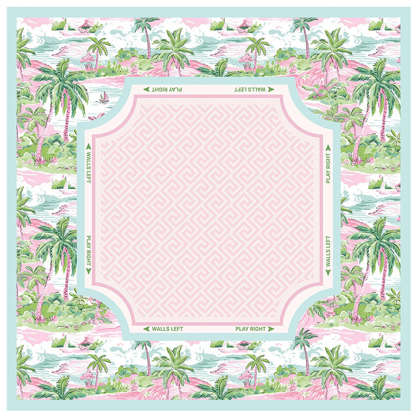 Tropical themed mahjong mat featuring mint green palm tree borders, a pink lattice center, and printed directional guides for American Mahjong.