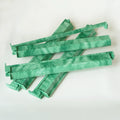 Set of four 17.5-inch green swirl patterned mahjong racks with attached pushers.