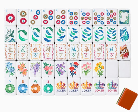 Full tile face layout of the Royal Aviary Majesty themed American Mahjong set, showcasing crown jokers, feather bams, owl dragons, and a caramel orange triple-layer backing.
